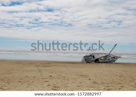 sail boat capsized and beached