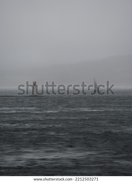 Sail boat on the\
Sound of Mull before a\
storm