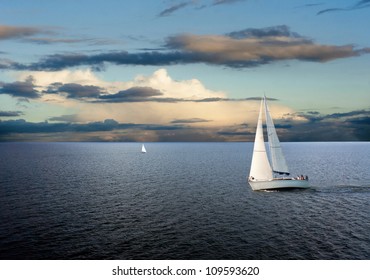 Sail Boats On Sea With Cloudy Sky