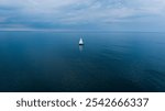 Sailboat in blue abyss middle of the ocean high resolution calm water screen saver serenity set sail voyage pacific atlantic ocean.