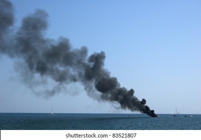 Sailboat burning in the sea