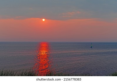 Sailboat and a Cloudy Sunset on Lake Michigan Near Montague, Michigan - Shutterstock ID 2156778383