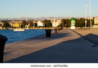 Sailboat Entering The Zadar Harbour, Velebit Mountains In Background