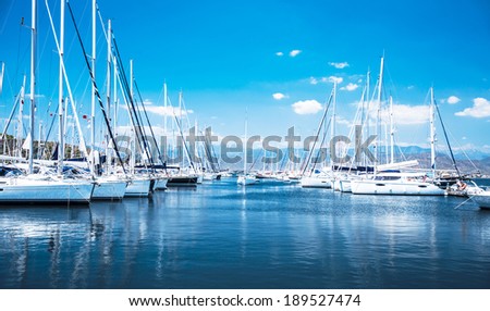 Sailboat harbor, many beautiful moored sail yachts in the sea port, modern water transport, summertime vacation, luxury lifestyle and wealth concept