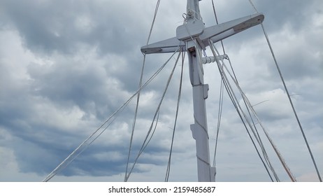 Sailboat Mast With Cloudy Sky