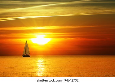 Sailboat on the ocean at sunset - Powered by Shutterstock