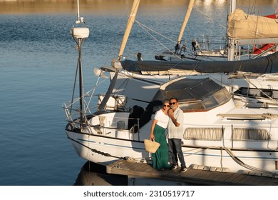 Sailboat Ownership. Senior Family Couple Standing Near Luxury Yacht Embracing Enjoying Holidays Leisure At Seaside Outdoor. Relaxed Husband And Wife Going On Sailing Tour In Summer. Full Length - Shutterstock ID 2310519717