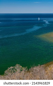 A Sailboat Plys The Waters Of Green Bay, Lake Michigan Off Of  Peninsula State Park,  Door County, Wisconsin