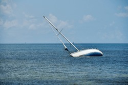 A Sailboat Runs Aground And Sinks In The Shallow Waters Around Key West
