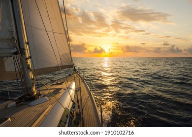 Sailboat sailing in the Mediterranean Sea at sunset - Powered by Shutterstock