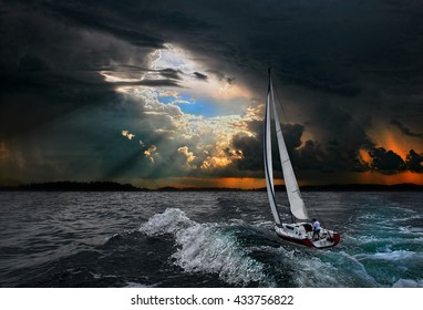Sailboat in the storm sea.Yacht and beautiful seascape.Travel on a sailing boat.A hurricane in a stormy sea.