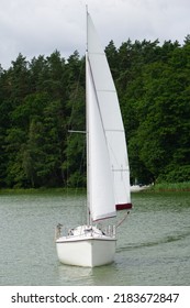 Sailboat Swimming On A Lake - Front View