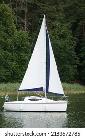 Sailboat Swimming On A Lake - Side View