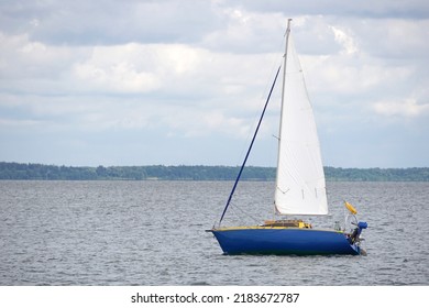 Sailboat Swimming On A Lake - Side View