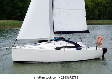 Sailboat Swimming On A Lake - Side View