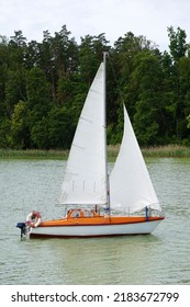 Sailboat Swimming On A Lake - Side View