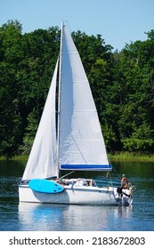 Sailboat Swimming On A Lake - Side View