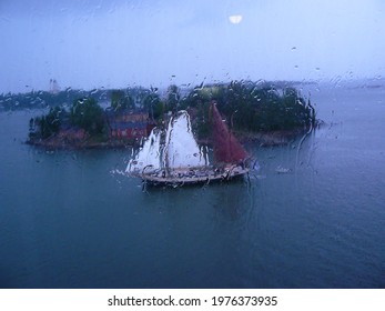 Sailboat through the window in rainy day
