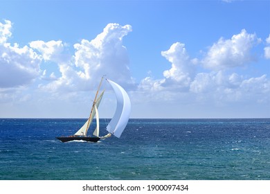 Sailboat With White Spinnaker Sailing Downwind