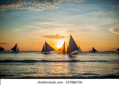 Sailboats With Blue Sails At Sunset, Boracay Island