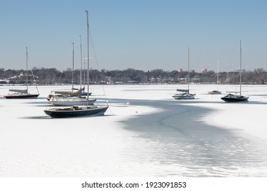 Sailboats On A Frozen White Rock Lake In Dallas, Texas After Severe Winter Weather. 