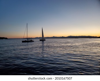 Sailboats At Sunset In Elliot Bay Off The Seattle Waterfront