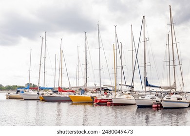 Sailboats and yachts parked in the seaport on summer, yacht port.  - Powered by Shutterstock