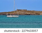 Sailing in the bay with the view of the Portoguese fort on the Ilheu du Djeu, Boa Vista Island, Cape Verde