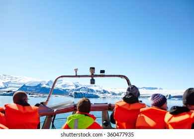 Sailing Between Icebergs In Jokulsarlon Lagoon, Iceland. Crowd On Amphibian Tour Among Melting Glaciers.