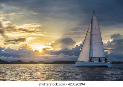 Sailing Boat In Calm Wind During Sunset