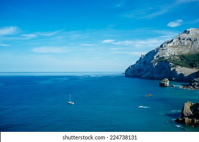 Sailing Boat Exploring Cliffs Of Bay Of Biscay