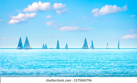 Sailing Boat Yacht Or Sailboat Group Regatta Race On Sea Or Ocean Water. Panoramic View.