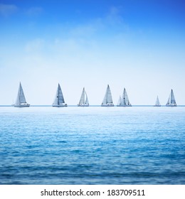 Sailing Boat Yacht Or Sailboat Group Regatta Race On Sea Or Ocean Water. Panoramic View.