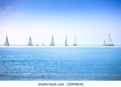 Sailing boat yacht or sailboat group regatta race on sea or ocean water. Panoramic view. - Powered by Shutterstock