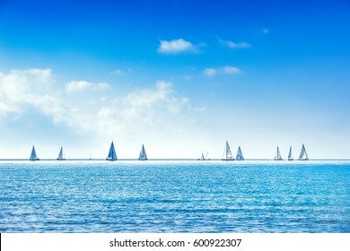 Sailing boat yacht or sailboat group regatta race on sea or ocean water. Panoramic view. - Powered by Shutterstock