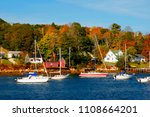 Sailing boats lie at anchor in the Harbour of Mahone Bay, Nova Scotia.