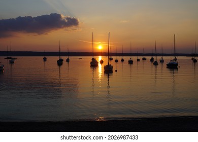 Sailing boats at sunset on Ammersee in Bavaria