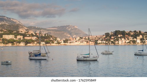 Sailing Boats At Sunset On Villefranche In French Riviera