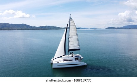 Sailing catamaran with open sails