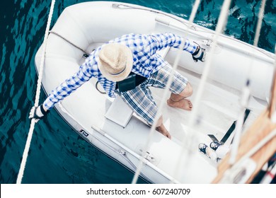 sailing man in the boat . 