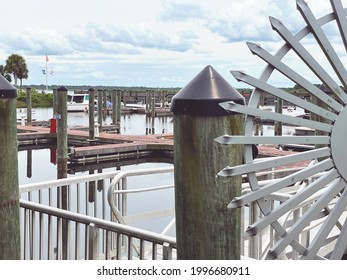 Sailing Object In Front Of Small Boat Dock