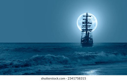 Sailing old ship in calm sea - Night sky with moon in the clouds "Elements of this image furnished by NASA - Powered by Shutterstock