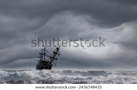 Sailing old ship in a storm sea in the background stormy clouds