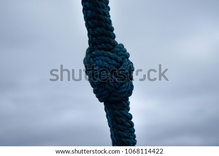 Sailing ship knob on the blue thik rope.