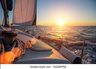 Sailing ship luxury yacht boat in the Sea during amazing sunset. 