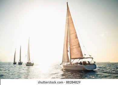 Sailing ship yachts with white sails in a row - Shutterstock ID 88284829