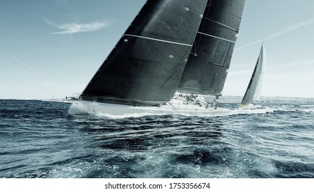 Sailing Ships Race. Beautiful Sailboats Under Sail On A Cruise Regatta. Travel And Tourism At Sea