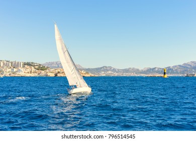 Sailing in the wind through the waves at the Sea