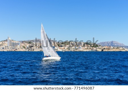 Sailing in the wind through the waves at the Sea