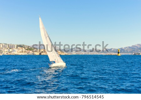Sailing in the wind through the waves at the Sea